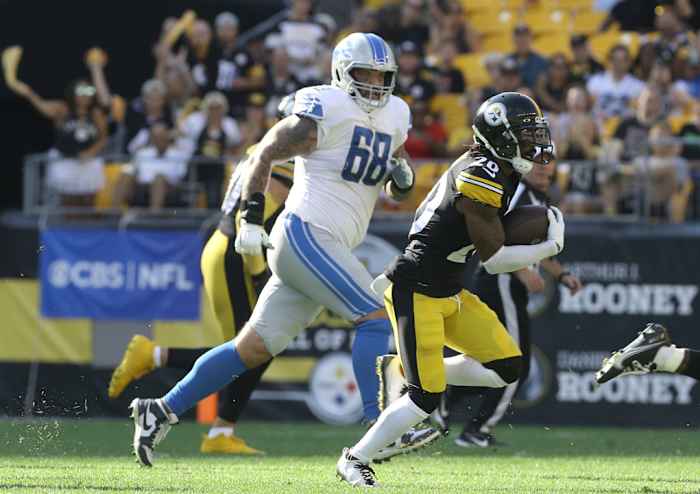 Pittsburgh Steelers cornerback Cameron Sutton returns an interception against the Detroit Lions.